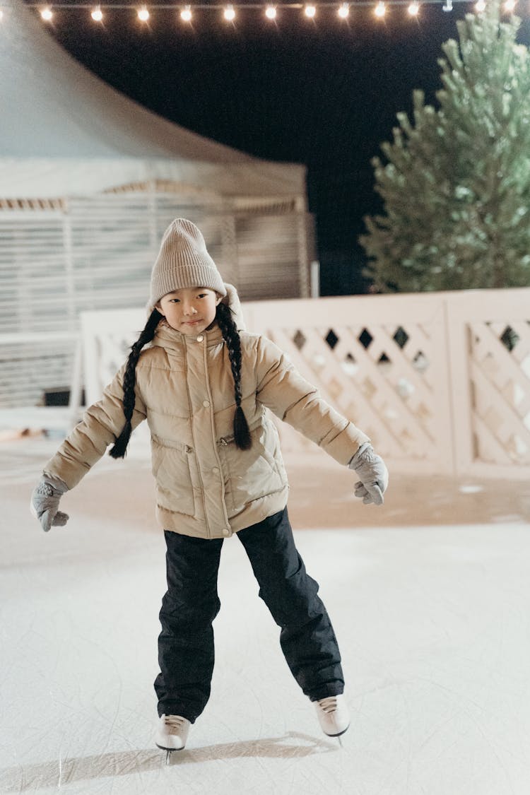 Cute Child Wearing Ice Skating Shoes