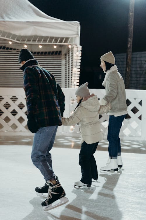 Family Skating on Ice Rink