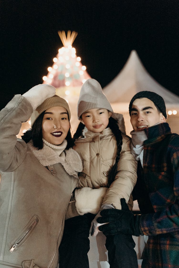 Happy Family Looking At Camera Smiling