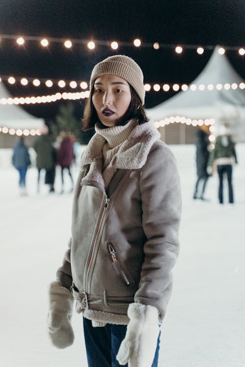 Woman Wearing a Winter Jacket on a Ice Rink