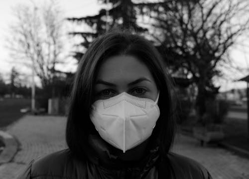 Free Woman Wearing a White Face Mask Stock Photo