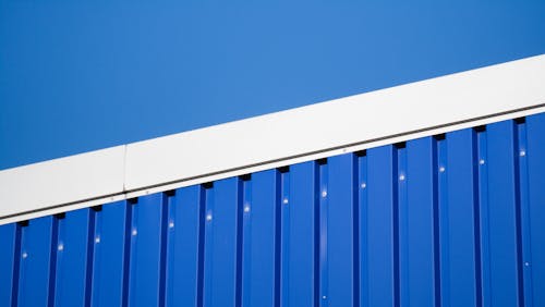 Sunlit, Blue Sheet Metal Wall
