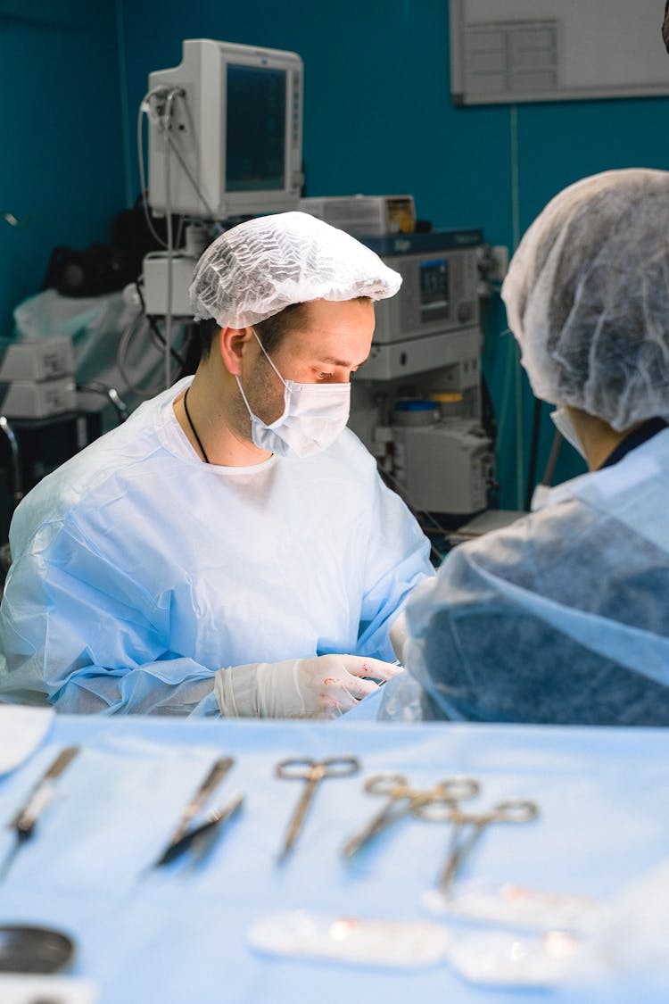 Doctors Performing A Surgery In An Operating Room