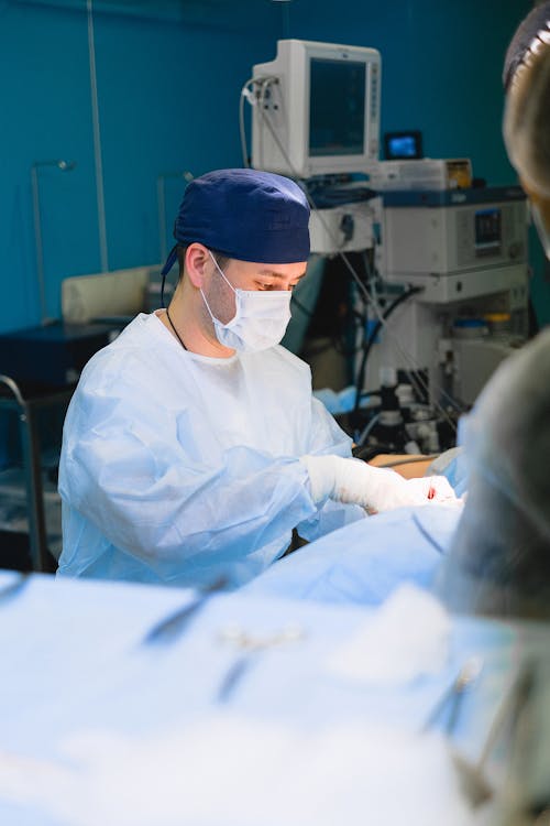 Free Surgeon Performing an Operation  Stock Photo
