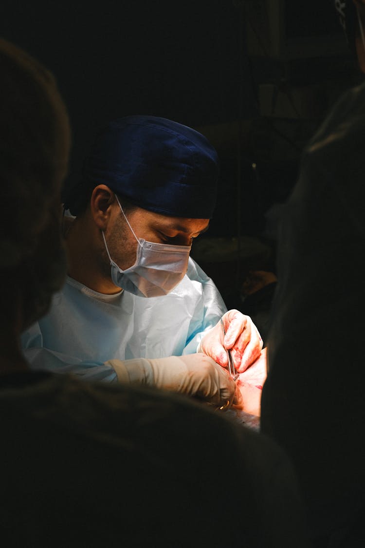 A Doctor Performing A Surgery