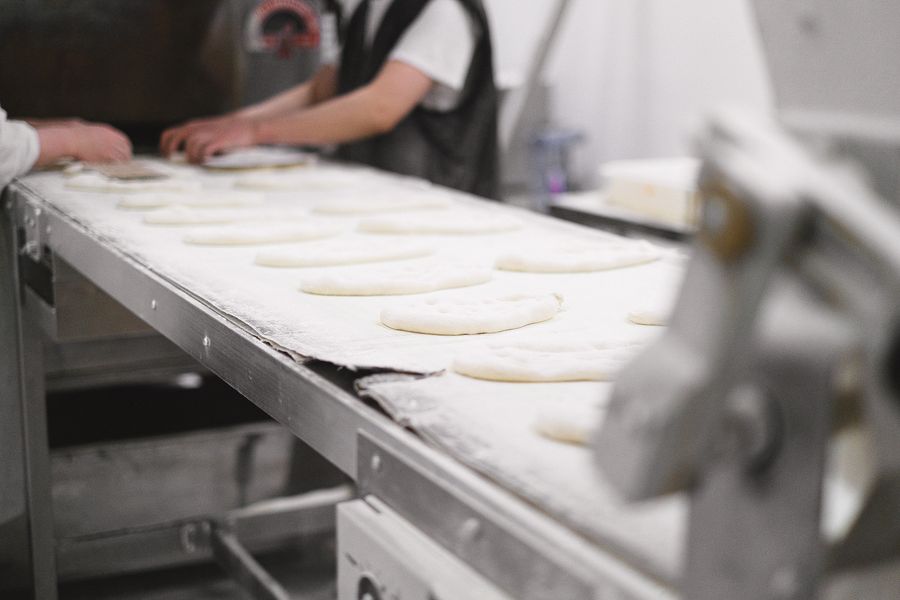 Dough on a food production conveyor
