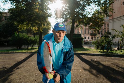 Elderly Man Playing Tennis