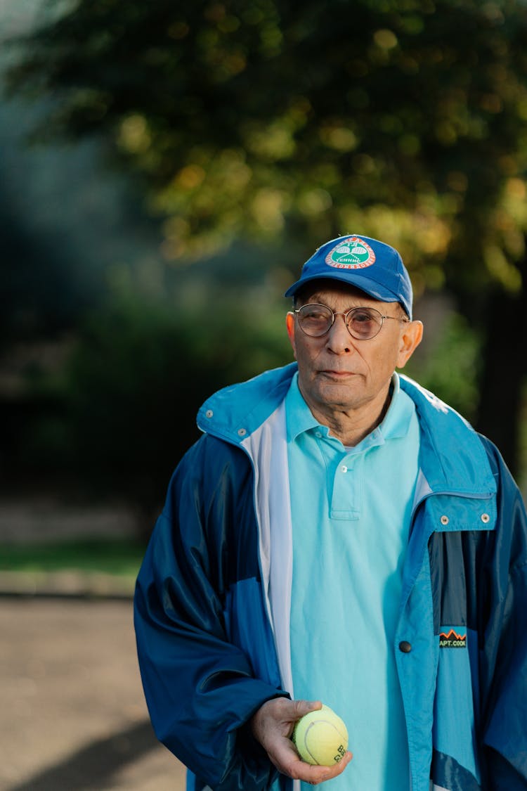 Man Holding A Tennis Ball