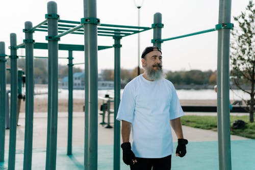 Bearded in White Crew Neck T-Shirt and Black Cap