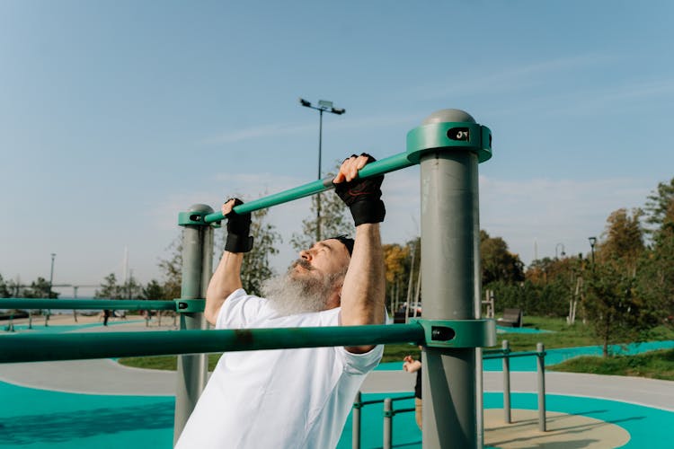 An Elderly Man Doing Pull Ups