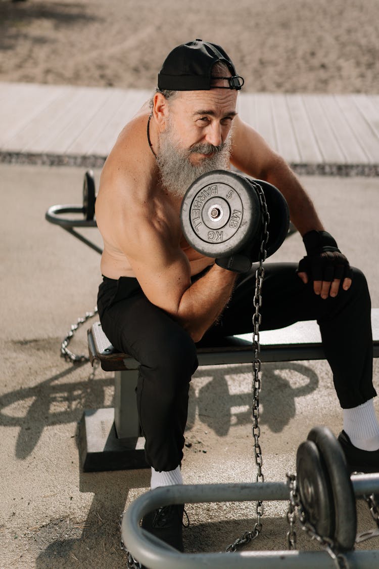 A Man Lifting Weights For Fitness