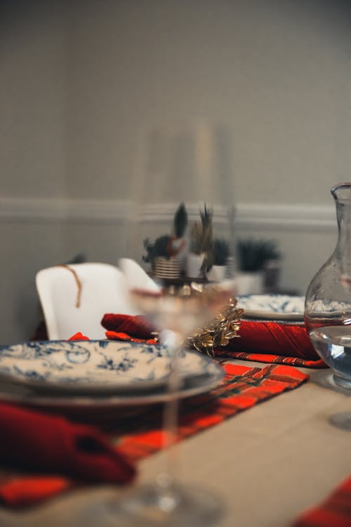 Table with napkins served with tableware