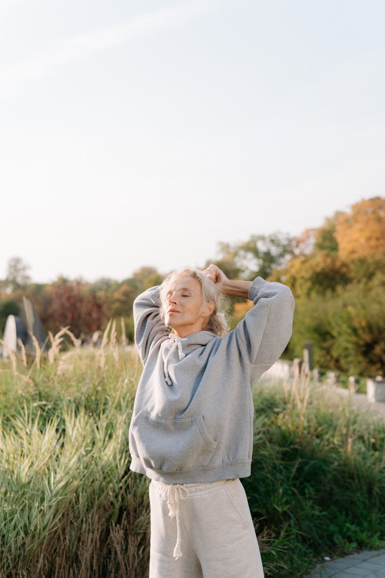 A Woman Stretching Her Arms