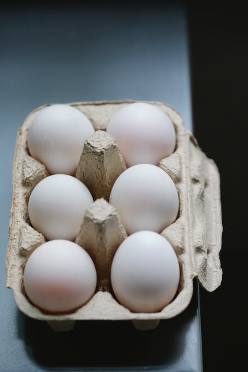Free White chicken eggs in carton container Stock Photo