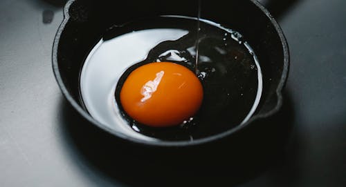 Free Process of cooking fried eggs on pan Stock Photo