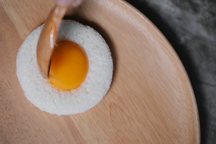 Process Of Putting Egg Yolk In Round Bread Crumb