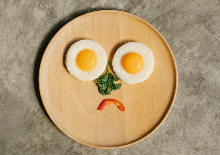 Tasty Yolks On Toasts Forming Sad Face