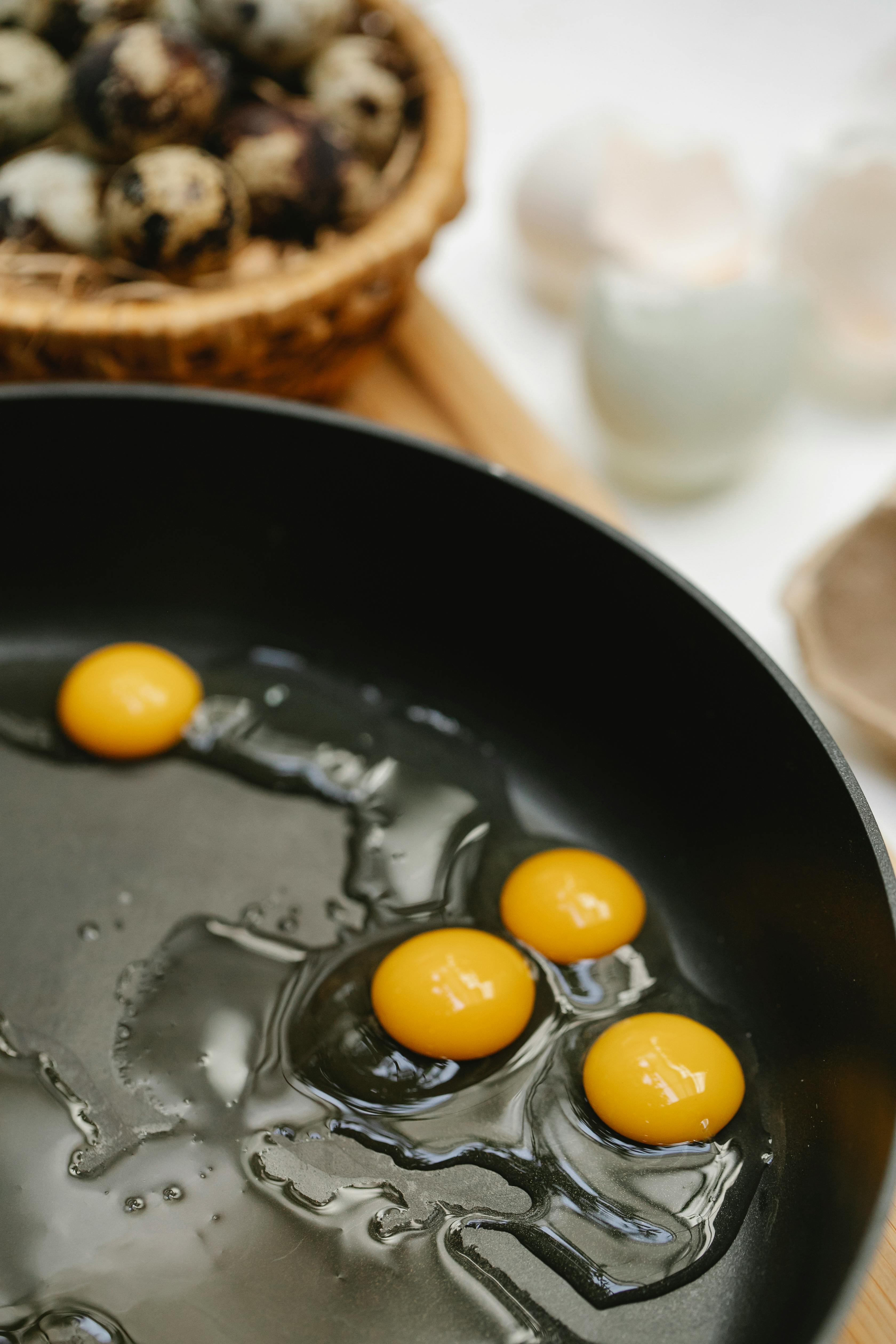 frying quail eggs on pan