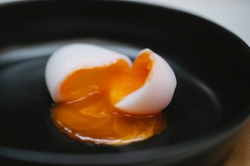 Free Halves of soft egg in bowl Stock Photo