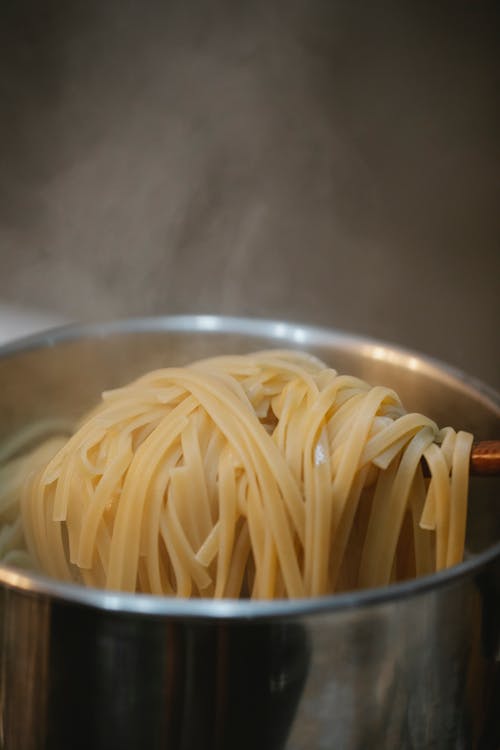 Process of cooking pasta in boiling water