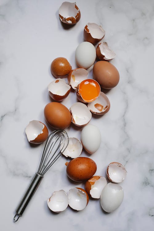 Chicken eggs placed on marble table