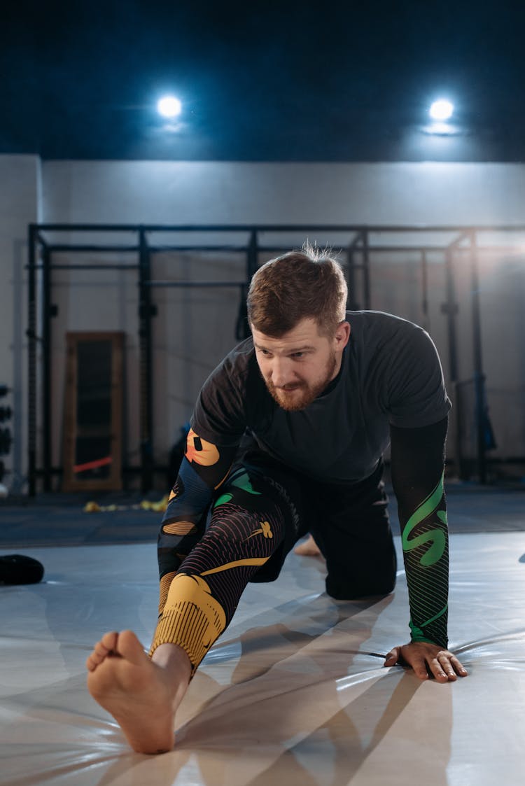 A Man Working Out In The Gym