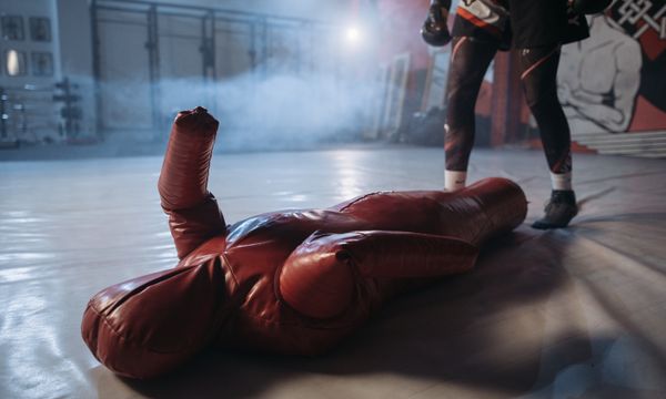 Person practicing CPR on training dummy