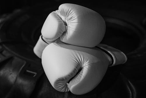 White Boxing Gloves in Close-Up Photography