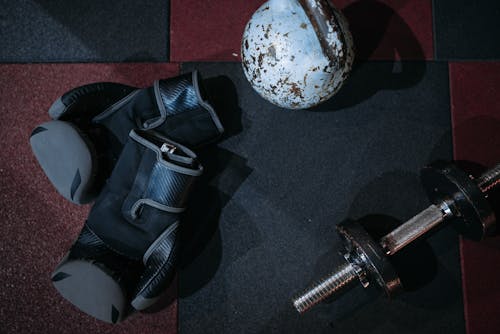 Dumbbells and Black Boxing Gloves