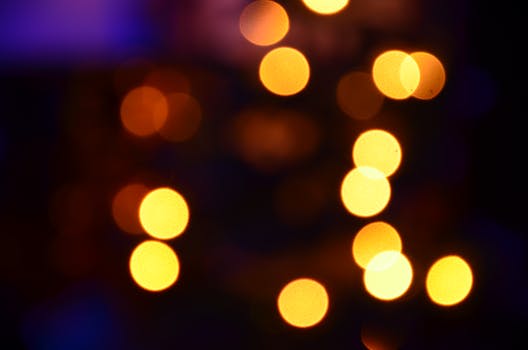 Vibrant bokeh circles creating an abstract light effect against a dark background.