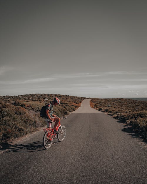 A Man riding a Bicycle