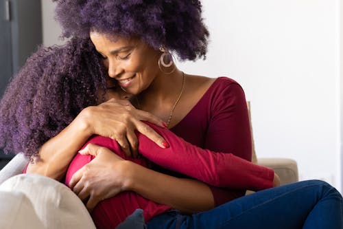 Free A Woman Hugging her Daughter Stock Photo