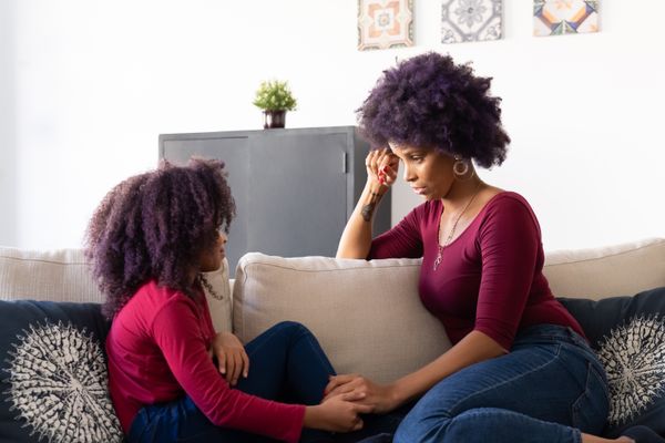 A mother and daughter talking on a sofa. Photo by Kampus Production on Pexels
