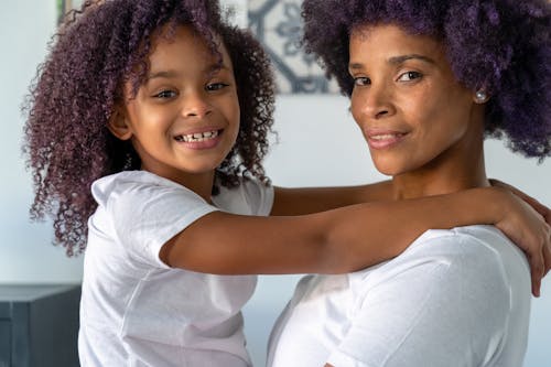A Mother and Daughter with Curly Hair 