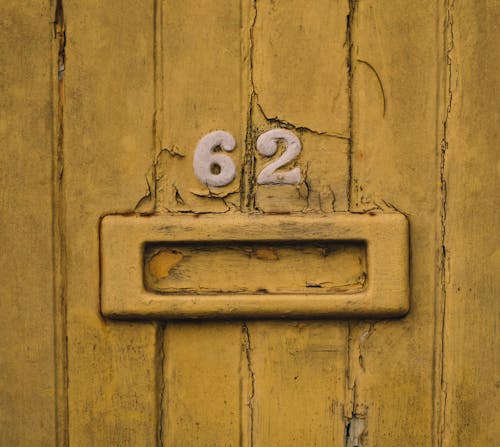Free Numbers on a Ugly Wooden Wall  Stock Photo