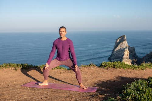 Barefooted Man Doing Yoga Outdoor