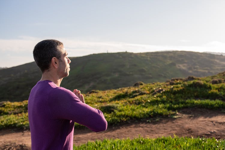 A Man Doing Yoga On A Mountain