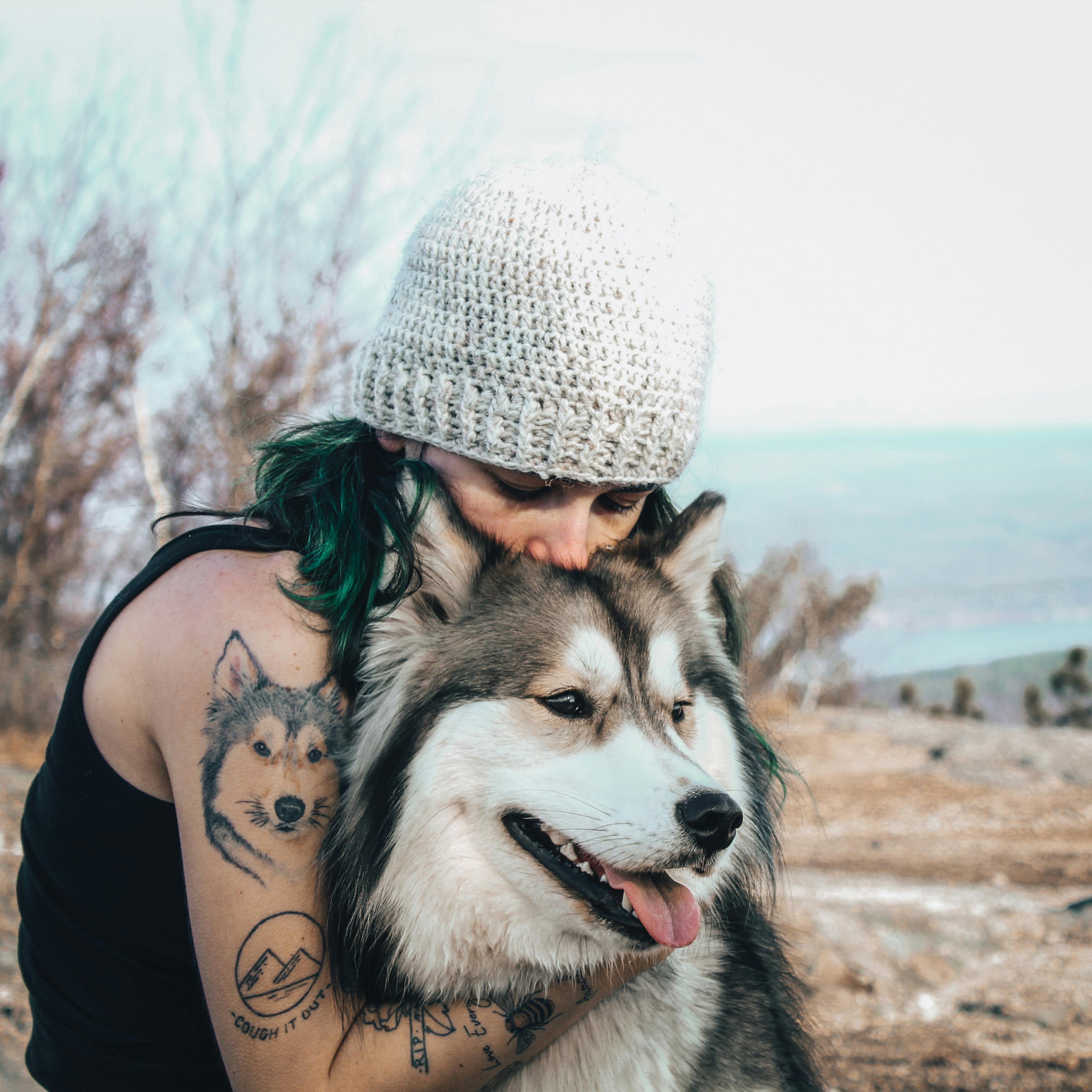 woman hugging a dog