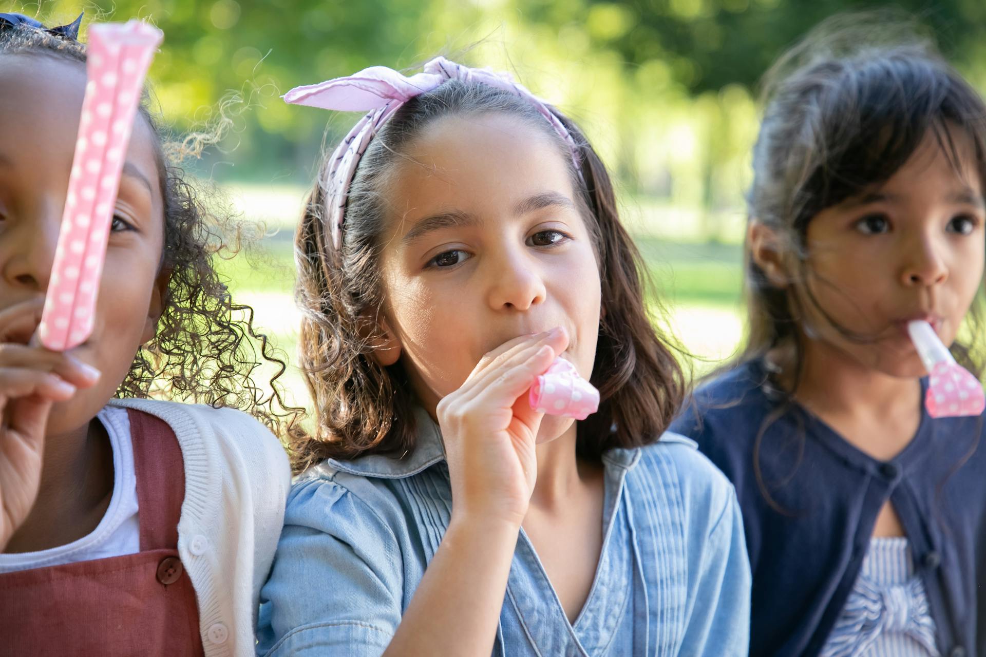 Kids Playing with a Whistle Toy