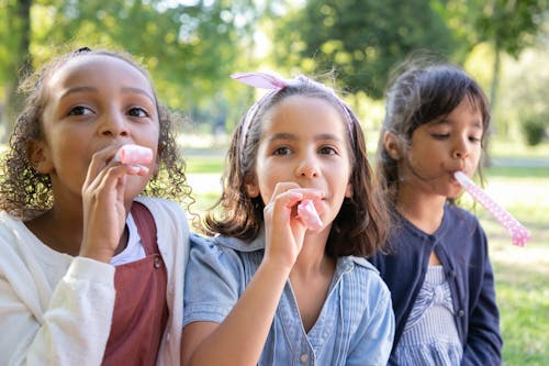 Free Girls Blowing Party Horns Stock Photo