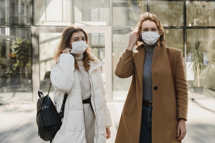 Women Removing Their Face Masks