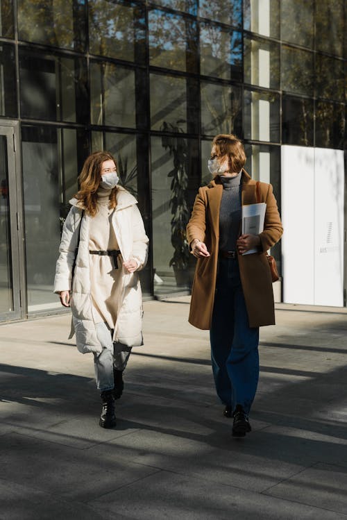 Free Women in Face Masks Walking Together Stock Photo