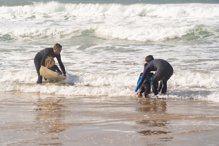 Kids Learning How To Surf