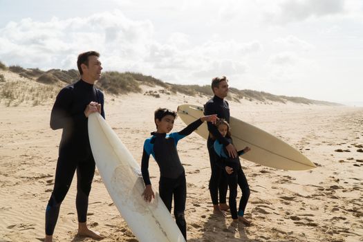 Men and Kids Standing at the Beach