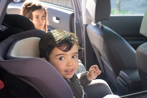 Boy Sitting on Car Seat