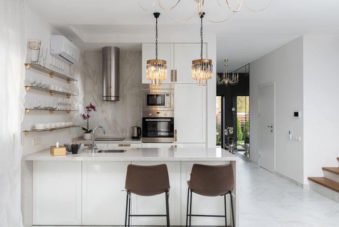 Refreshed white kitchen with marble accents
