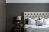 Cozy bedroom with pillows and lamp