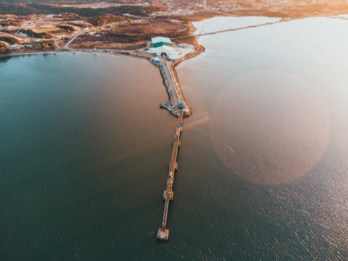 View of coastline and pier near sea