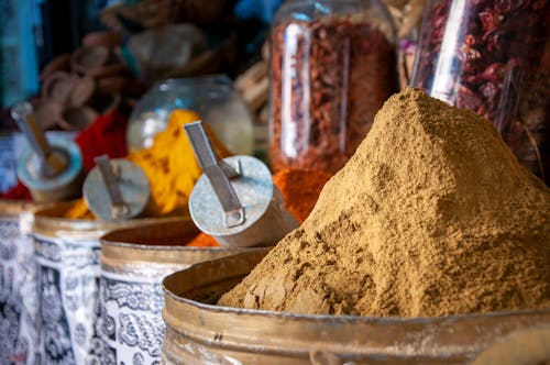 Free Various colorful spices in local market on sunny day Stock Photo