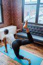 Black woman doing donkey kick exercise